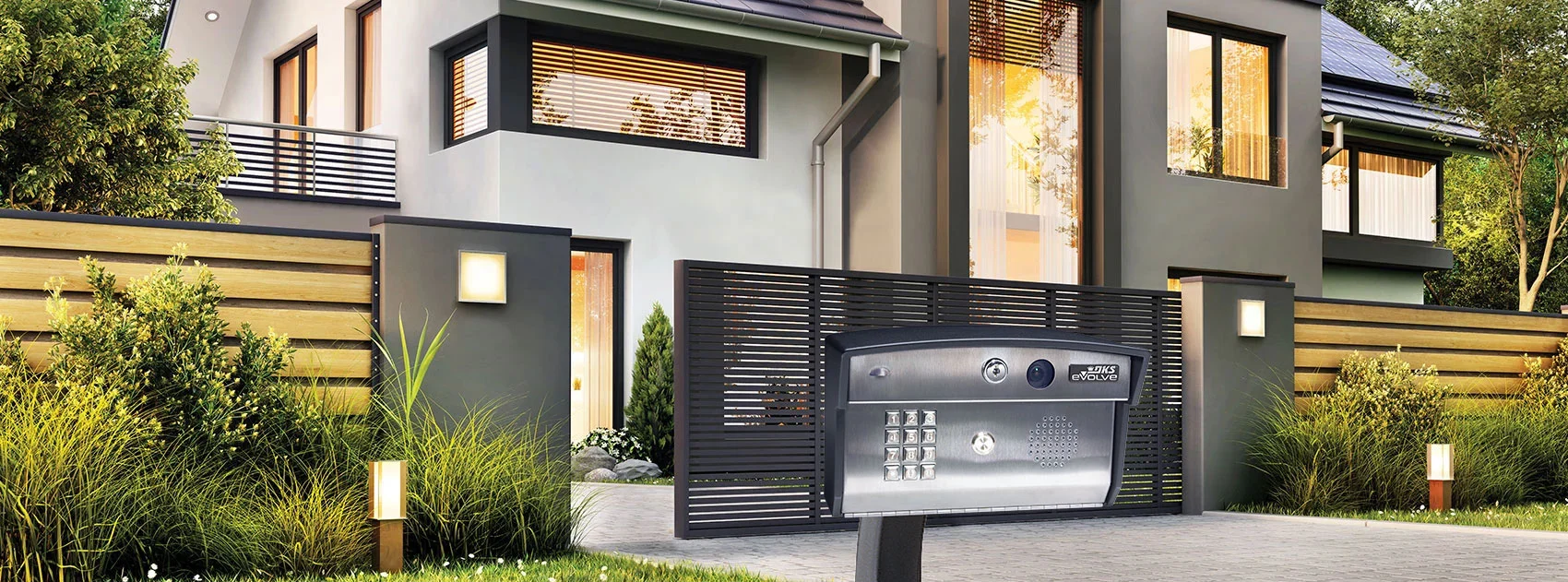 DKS 2112 eVolve video entry system installed at a gated residential entrance, with descriptive text outlining remote control, video calling, and multi-device connectivity capabilities.