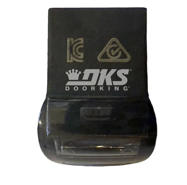 Close-up of the DKS onboard USB module used for programming, firmware updates, and data transfer on DoorKing gate operator systems.